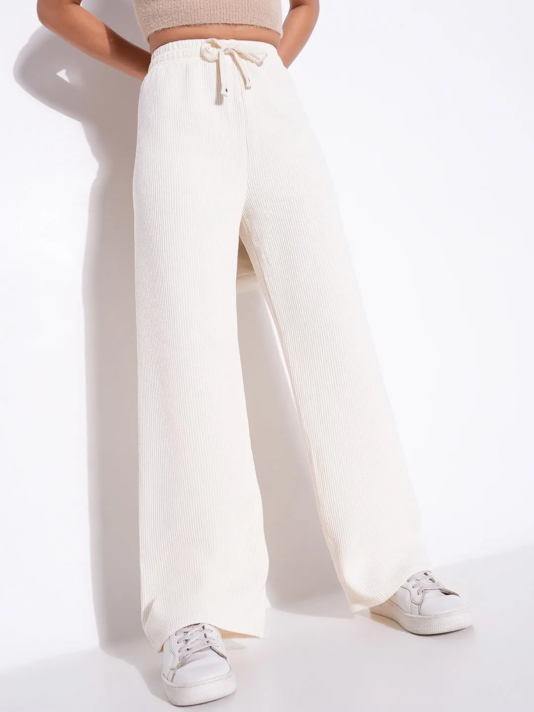 Women Off White Solid Parallel Trousers